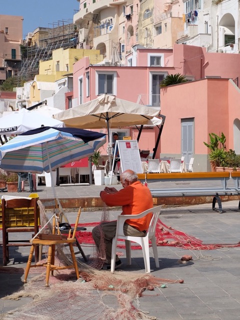 fixing fishing nets at Marina Corricella